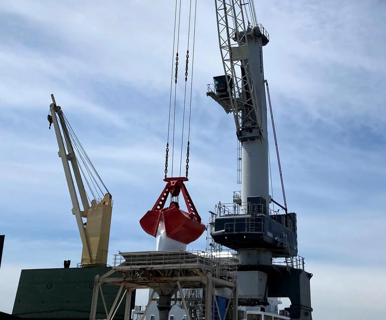 Liebherr crane unloading drybulk with clamshell grab