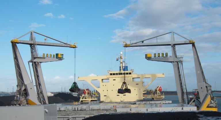 Cranes with grabs in harbor