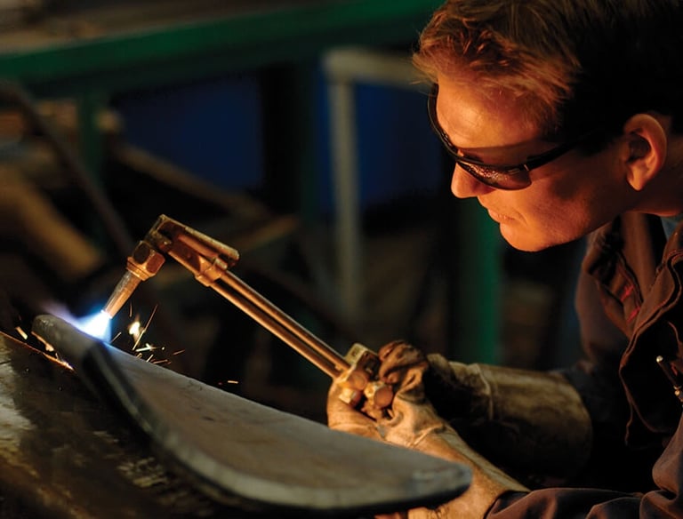 Welding a grab in progress