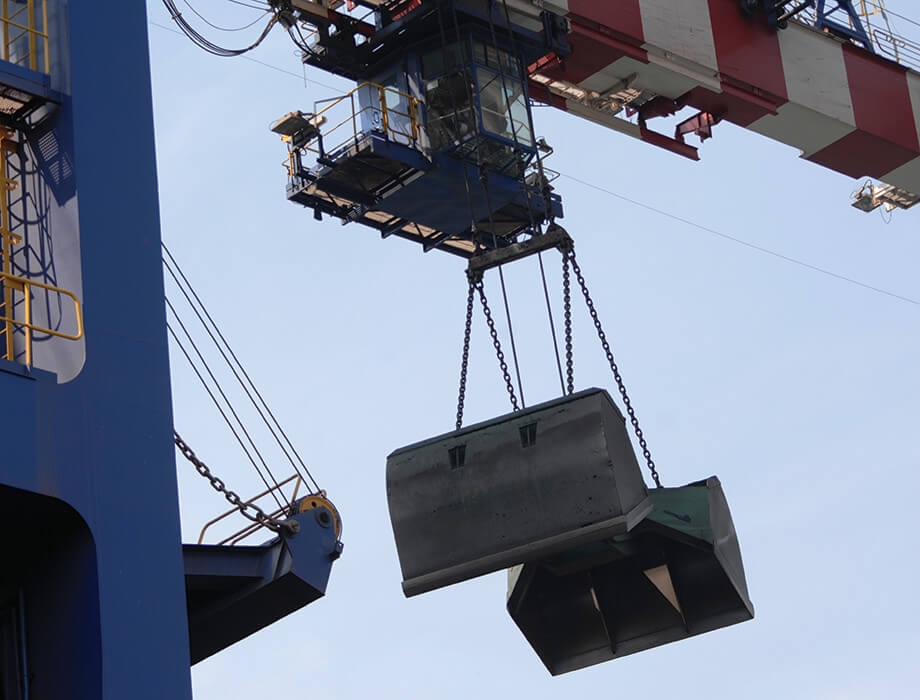 Crane with grab operating